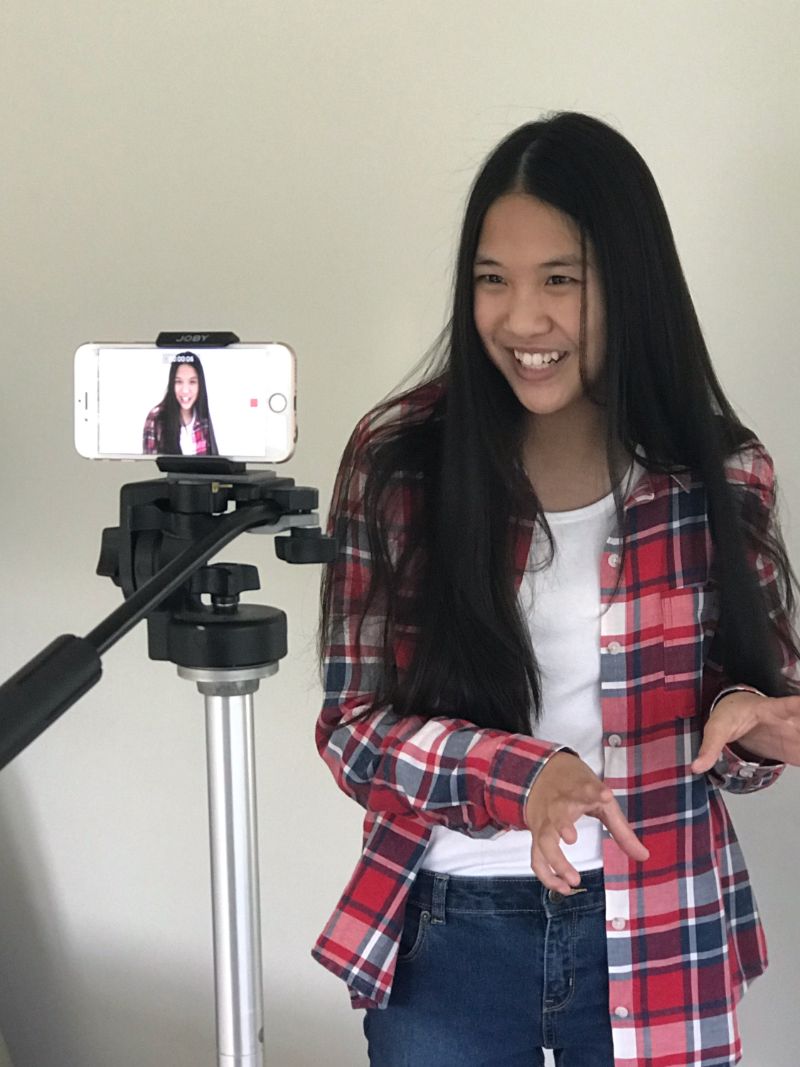 Charlie Kersh recording a video of herself